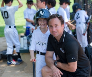 New York Empire Baseball founder Jordan Baltimore with one of his young players.